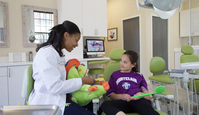 Doctor with Patient at Montclair Pediatric Dental Care Serving Verona, Clifton, Bloomfield, West Orange and Glen Ridge